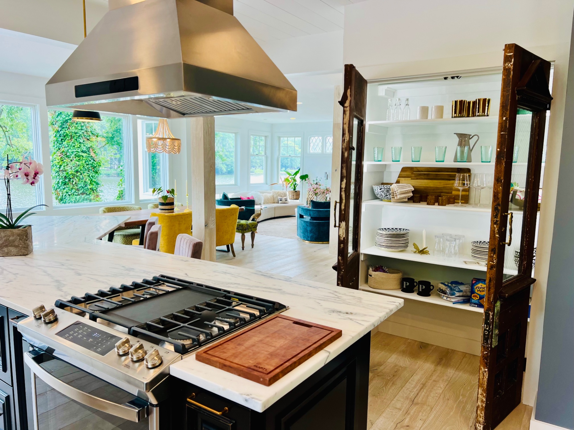 Lakeside kitchen with stainless hood and antique doors