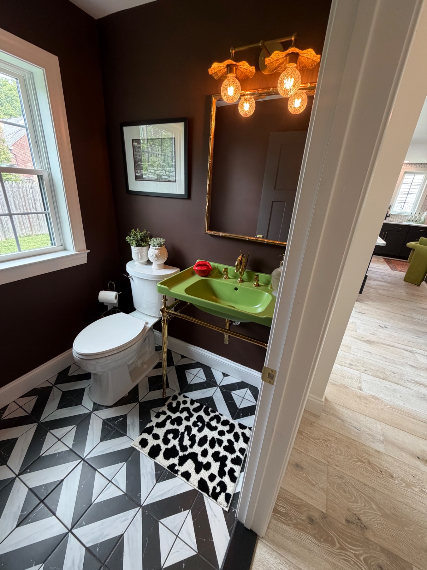 Plum powder room with green sink
