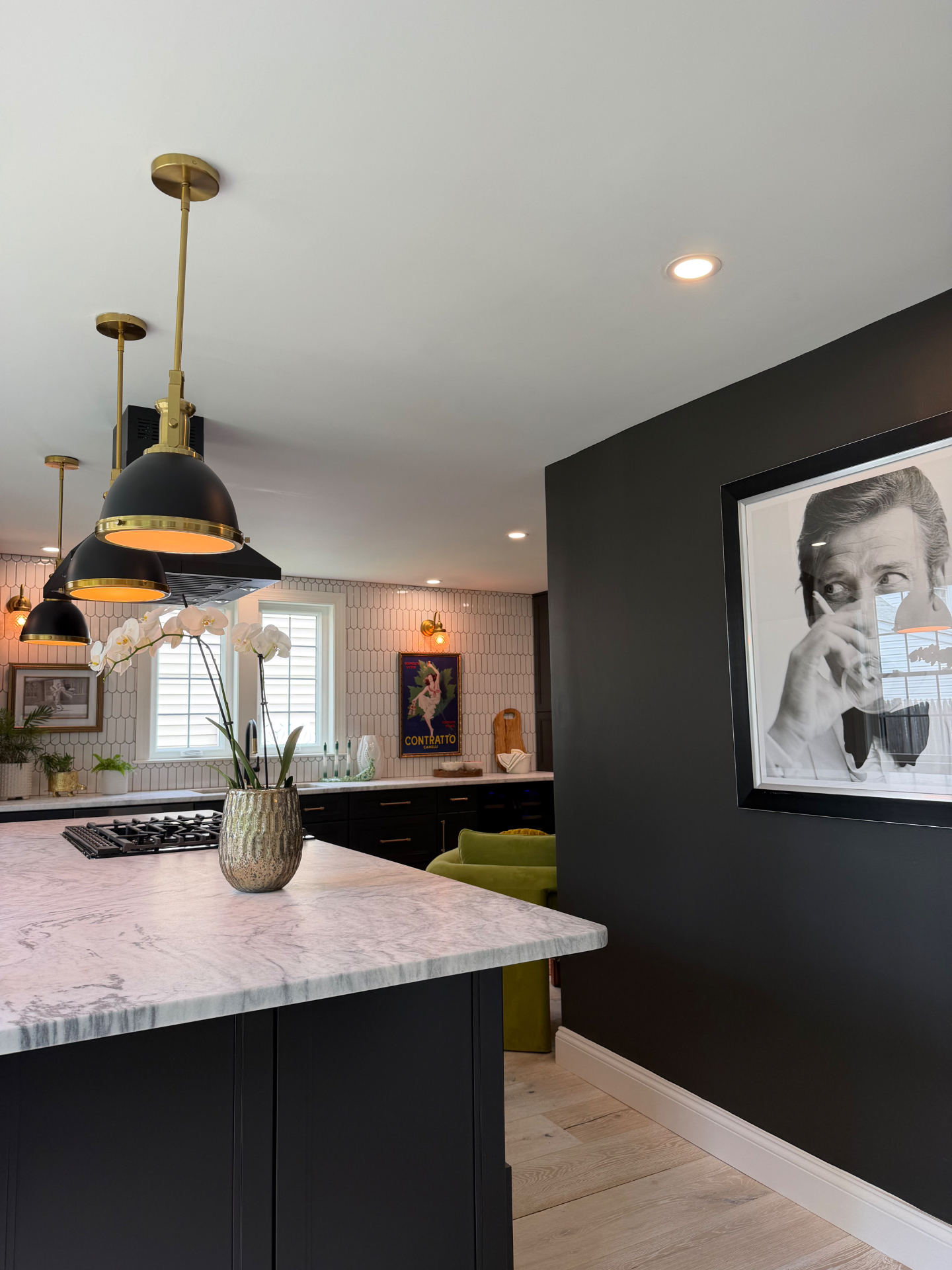 Moody kitchen with brass pendants